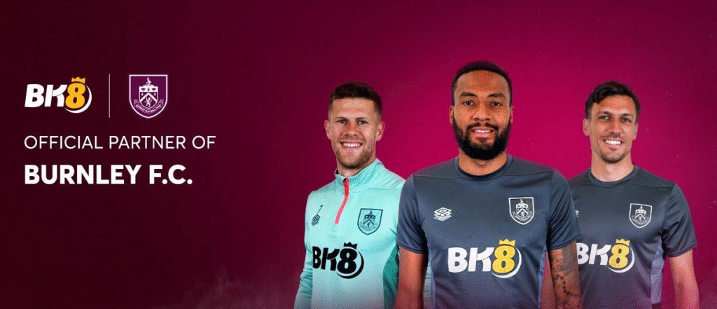 Promotional banner reading “Official Partner of Burnley F.C.” with three players wearing Burnley kits, prominent BK8 logo and club crest on a maroon background — BK8, Burnley F.C., sponsorship, football kit